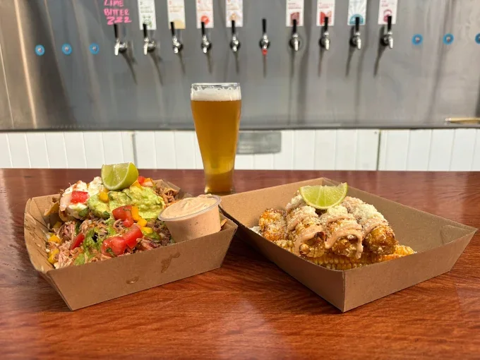 Freak Eats dishes with a beer at Happy Brewery - Freak Eats food truck gallery