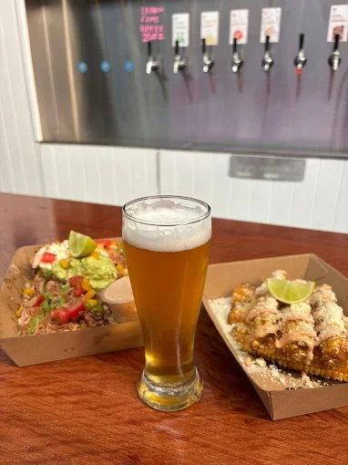 Freak Eats feed with a cold beer - Freak Eats food truck gallery