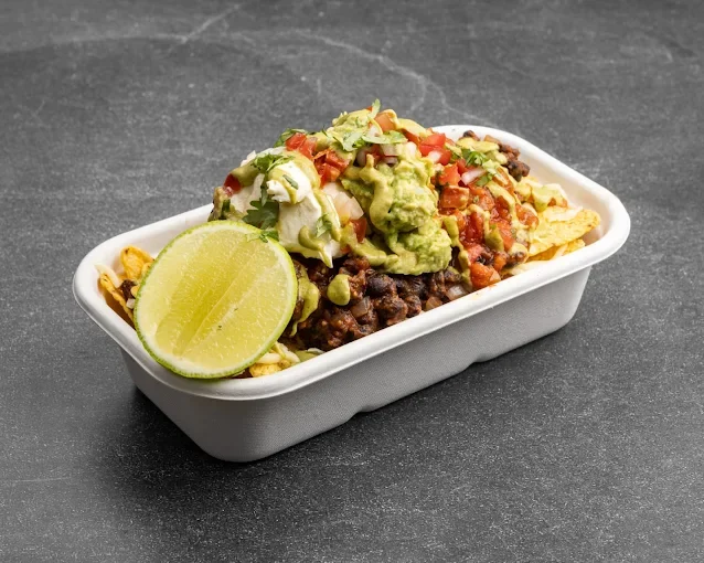 Loaded nachos with lime and guacamole - Freak Eats food truck gallery